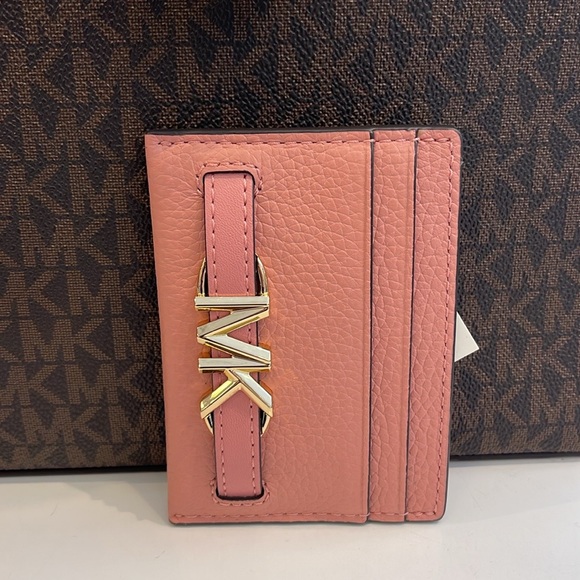 MICHAEL KORS
Reed Large Pebbled Leather Card Holder Case
Primrose 
NWT - Picture 8 of 16
